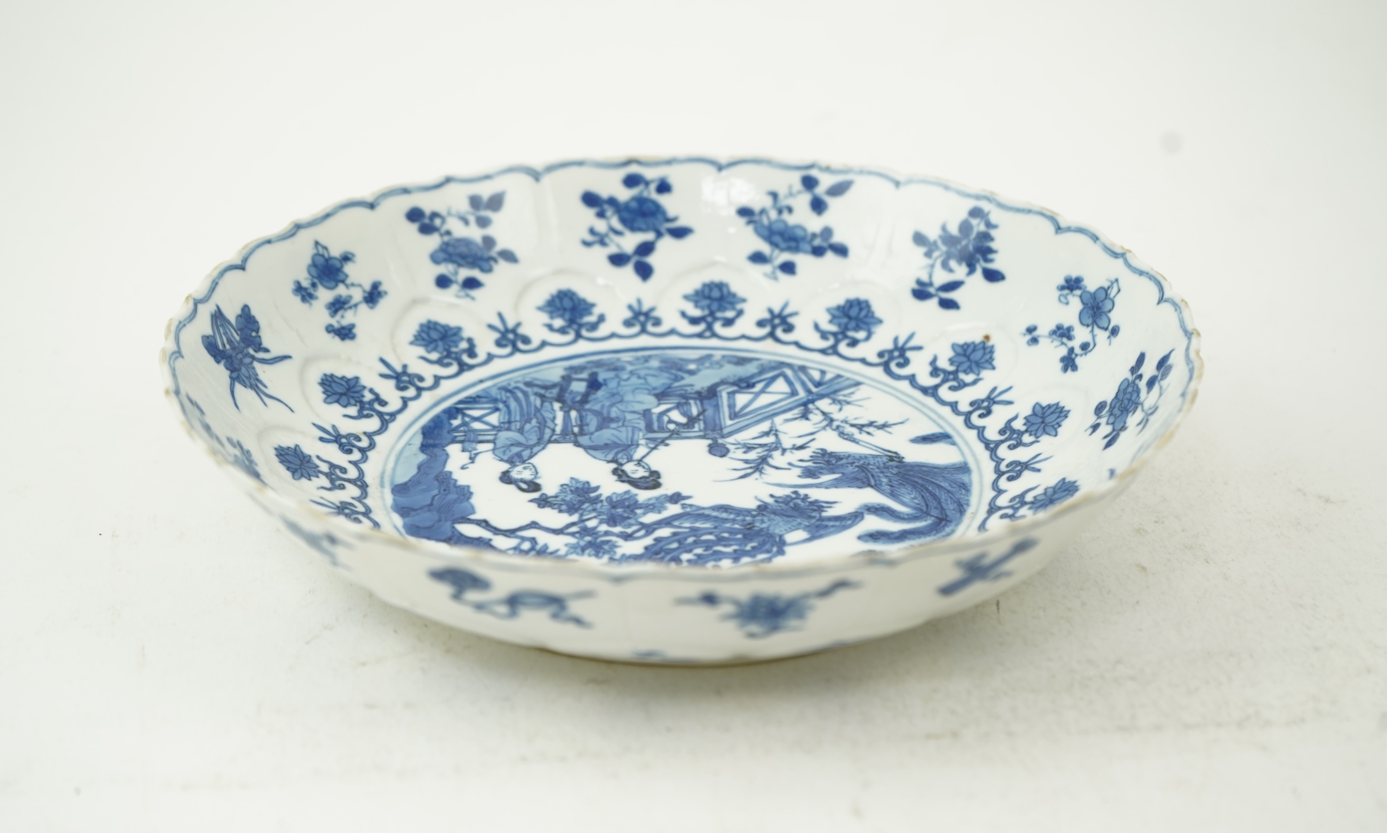 A Chinese blue and white ‘ladies and phoenix’ dish, Kangxi period